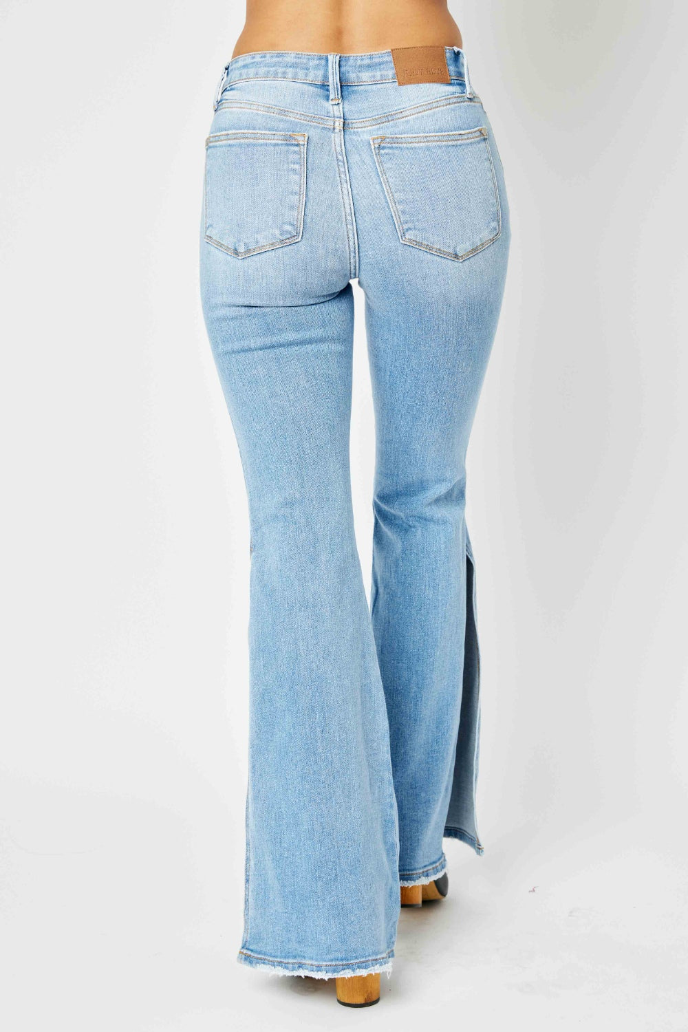 Judy Blue Full Size Mid Rise Raw Hem Slit Flare Jeans-Teresa&#39;s Fashionista LLC