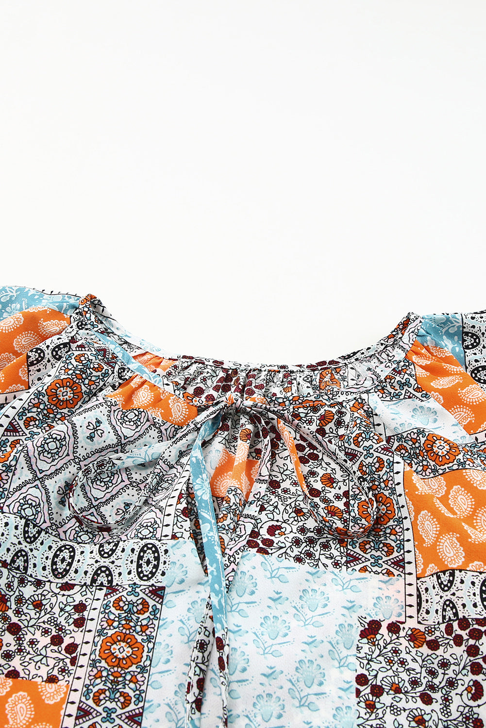 Printed Tie Neck Curved Hem Top-Teresa&#39;s Fashionista LLC